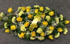 YELLOW ROSE AND CARNATION CASKET SPRAY
