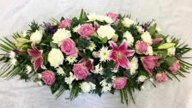 ROSE, LILY AND THISTLE CASKET SPRAY